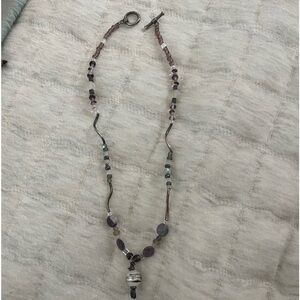 Handmade beaded necklace- different colors of purple. 18 inches across